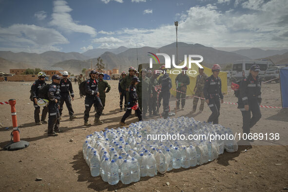 The Spanish rescue team Ericam works with Moroccan firefighters during an operation near the village of Talat N'Yaabouq in the Atlas Mountai...