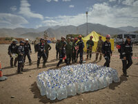 The Spanish rescue team Ericam works with Moroccan firefighters during an operation near the village of Talat N'Yaabouq in the Atlas Mountai...