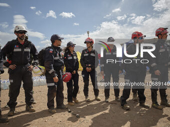 The Spanish rescue team Ericam works with Moroccan firefighters during an operation near the village of Talat N'Yaabouq in the Atlas Mountai...