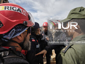 The Spanish rescue team Ericam works with Moroccan firefighters during an operation near the village of Talat N'Yaabouq in the Atlas Mountai...