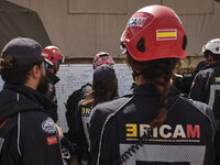 The Spanish rescue team Ericam works with Moroccan firefighters during an operation near the village of Talat N'Yaabouq in the Atlas Mountai...