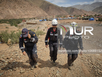 The Spanish rescue team Ericam works with Moroccan firefighters during an operation near the village of Talat N'Yaabouq in the Atlas Mountai...