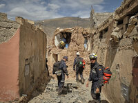 The Spanish rescue team Ericam works with Moroccan firefighters during an operation near the village of Talat N'Yaabouq in the Atlas Mountai...