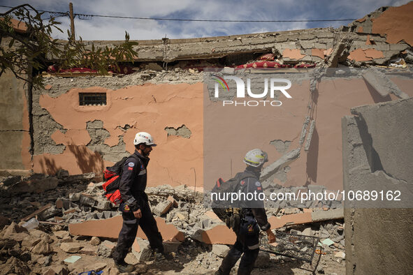 The Spanish rescue team Ericam works with Moroccan firefighters during an operation near the village of Talat N'Yaabouq in the Atlas Mountai...