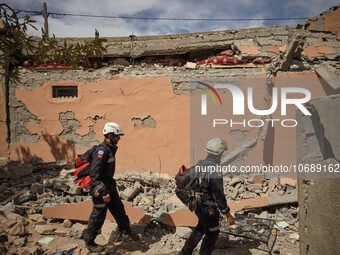 The Spanish rescue team Ericam works with Moroccan firefighters during an operation near the village of Talat N'Yaabouq in the Atlas Mountai...