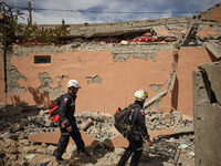 The Spanish rescue team Ericam works with Moroccan firefighters during an operation near the village of Talat N'Yaabouq in the Atlas Mountai...