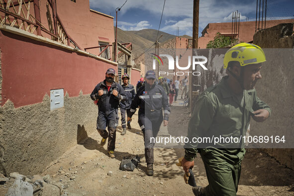 The Spanish rescue team Ericam works with Moroccan firefighters during an operation near the village of Talat N'Yaabouq in the Atlas Mountai...