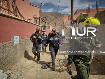 The Spanish rescue team Ericam works with Moroccan firefighters during an operation near the village of Talat N'Yaabouq in the Atlas Mountai...