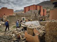 The Spanish rescue team Ericam works with Moroccan firefighters during an operation near the village of Talat N'Yaabouq in the Atlas Mountai...