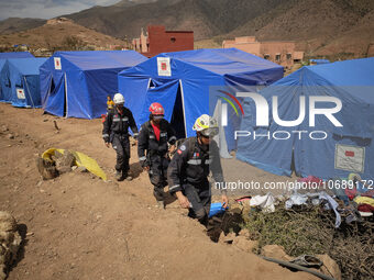 The Spanish rescue team Ericam works with Moroccan firefighters during an operation near the village of Talat N'Yaabouq in the Atlas Mountai...