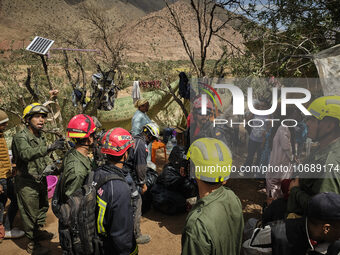 The Spanish rescue team Ericam works with Moroccan firefighters during an operation near the village of Talat N'Yaabouq in the Atlas Mountai...