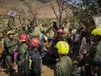 The Spanish rescue team Ericam works with Moroccan firefighters during an operation near the village of Talat N'Yaabouq in the Atlas Mountai...