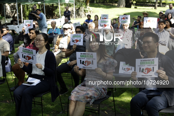 October 25, 2023, Mexico City, Mexico: Attendees of the China Cultural Festival in Los Pinos show posters in support of those affected in Ac...