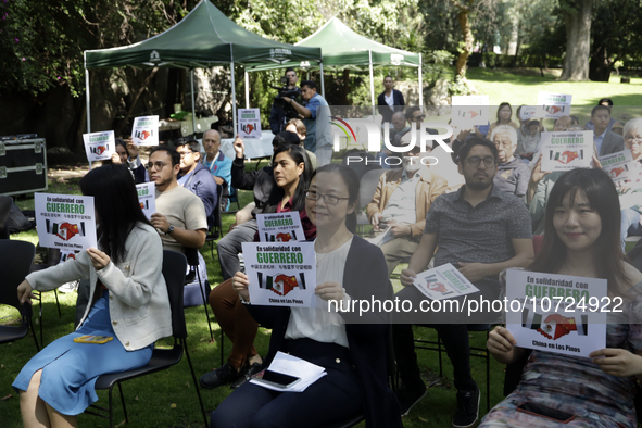 October 25, 2023, Mexico City, Mexico: Attendees of the China Cultural Festival in Los Pinos show posters in support of those affected in Ac...