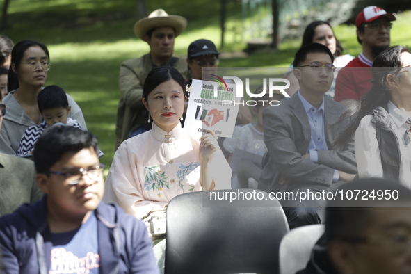 October 25, 2023, Mexico City, Mexico: Attendees of the China Cultural Festival in Los Pinos show posters in support of those affected in Ac...