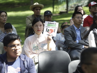 October 25, 2023, Mexico City, Mexico: Attendees of the China Cultural Festival in Los Pinos show posters in support of those affected in Ac...