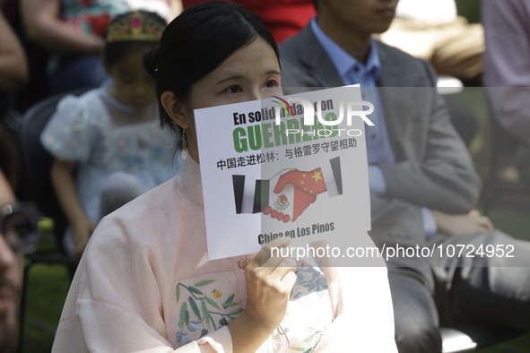 October 25, 2023, Mexico City, Mexico: Attendees of the China Cultural Festival in Los Pinos show posters in support of those affected in Ac...