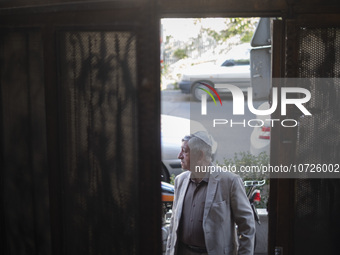 An Iranian-Jewish man stands at the door of a synagogue in downtown Tehran during a gathering to protest against the Israeli attacks on Pale...