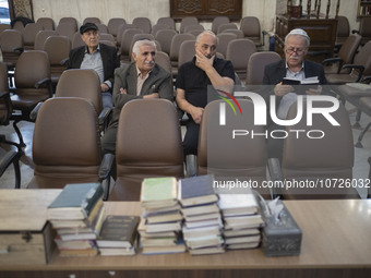 An Iranian-Jewish man reads a Hebrew Bible while sitting at a synagogue in downtown Tehran during a gathering to protest against Israeli att...