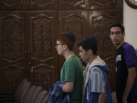 Iranian-Jewish men stand at a synagogue in downtown Tehran during a gathering to protest against Israeli attacks on Palestinian civilians, O...