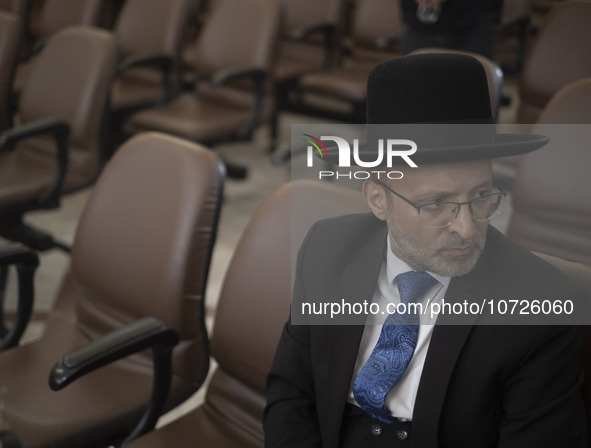 An unidentified Jewish Rabbi, looks on while sitting at a synagogue in downtown Tehran during a gathering to protest against Israeli attacks...