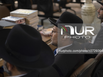 Unidentified Jewish Rabbis sit at a synagogue in downtown Tehran during a gathering to protest against Israeli attacks on Palestinian civili...