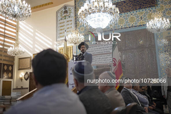 A Jewish Rabbi (C), speaks at a synagogue in downtown Tehran during a gathering to protest against Israeli attacks on Palestinian civilians,...