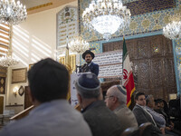 A Jewish Rabbi (C), speaks at a synagogue in downtown Tehran during a gathering to protest against Israeli attacks on Palestinian civilians,...