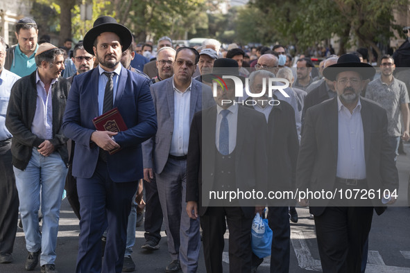 Rabbi Younes Hamami Lalehzar (R), Leader of Iranian Jews, and two other Jewish Rabbis, walk during a rally  in support of Palestine, in down...