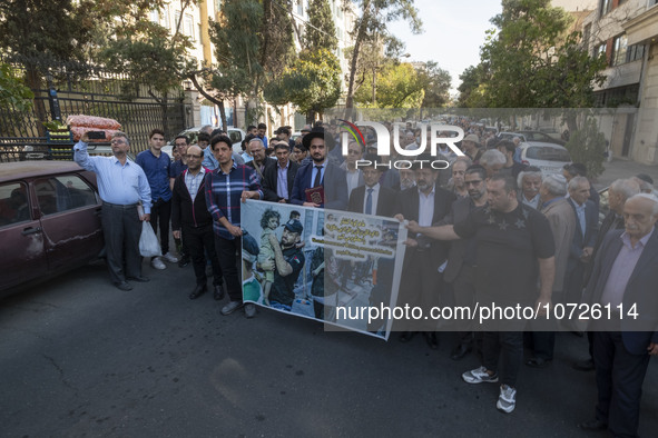 Rabbi Younes Hamami Lalehzar, Leader of Iranian Jews, and two other Jewish Rabbis, stand behind an anti-Israeli banner during a rally  in su...