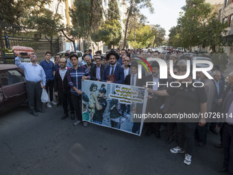 Rabbi Younes Hamami Lalehzar, Leader of Iranian Jews, and two other Jewish Rabbis, stand behind an anti-Israeli banner during a rally  in su...