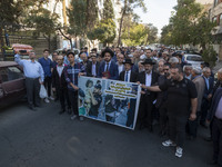 Rabbi Younes Hamami Lalehzar, Leader of Iranian Jews, and two other Jewish Rabbis, stand behind an anti-Israeli banner during a rally  in su...