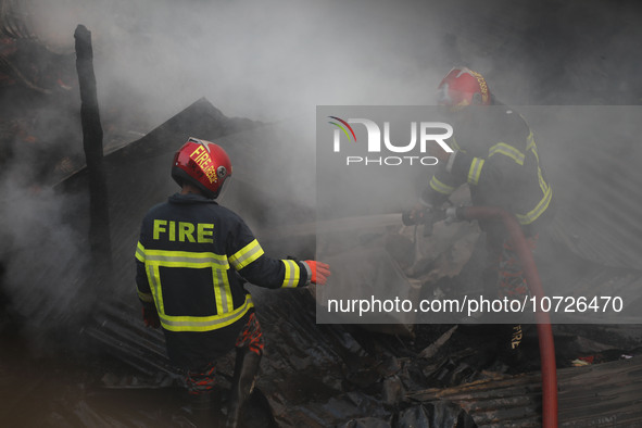 Fire service personnel from Bangladesh are currently extinguishing a fire that erupted in Baburhat, Narsingdi, Bangladesh, on October 30, 20...