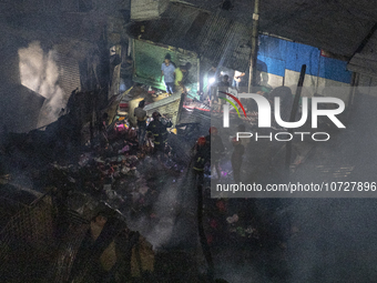 Bangladeshi fire fighters try to extinguish a fire that broke out Baburhat, Narsingdi on October 30, 2023, which is one of the biggest tradi...