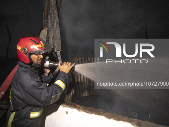 Bangladeshi fire fighters try to extinguish a fire that broke out Baburhat, Narsingdi on October 30, 2023, which is one of the biggest tradi...