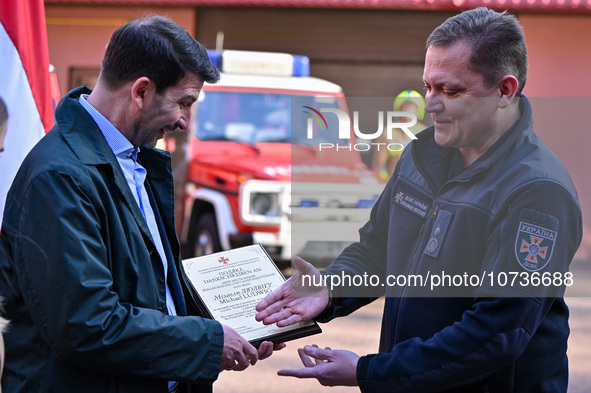 LVIV, UKRAINE - OCTOBER 30, 2023 - Ambassador Extraordinary and Plenipotentiary of the Republic of Austria to Ukraine Arad Benko (L) shakes...