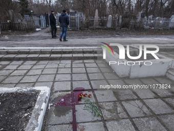 Blood in the location where Yuri Dement, the closest partner of the mayor of Kharkiv, Gennady Kernes, was shot dead near his mother's grave...