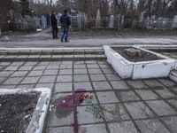 Blood in the location where Yuri Dement, the closest partner of the mayor of Kharkiv, Gennady Kernes, was shot dead near his mother's grave...