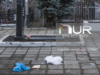 Blood in the location where Yuri Dement, the closest partner of the mayor of Kharkiv, Gennady Kernes, was shot dead near his mother's grave...