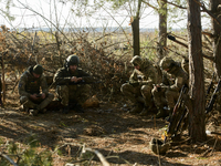 Servicemen of the First Presidential National Guard Brigade of Ukraine BUREVIY (Storm) during a practical exercise at a training ground in n...