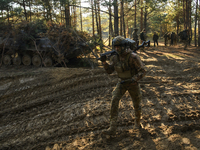 Servicemen of the First Presidential National Guard Brigade of Ukraine BUREVIY (Storm) during a practical exercise at a training ground in n...