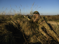 Servicemen of the First Presidential National Guard Brigade of Ukraine BUREVIY (Storm) during a practical exercise at a training ground in n...