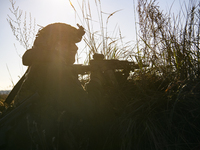 Servicemen of the First Presidential National Guard Brigade of Ukraine BUREVIY (Storm) during a practical exercise at a training ground in n...