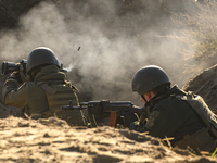 Servicemen of the First Presidential National Guard Brigade of Ukraine BUREVIY (Storm) during a practical exercise at a training ground in n...