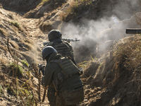 Servicemen of the First Presidential National Guard Brigade of Ukraine BUREVIY (Storm) during a practical exercise at a training ground in n...