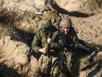 Servicemen of the First Presidential National Guard Brigade of Ukraine BUREVIY (Storm) during a practical exercise at a training ground in n...