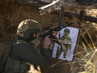 Servicemen of the First Presidential National Guard Brigade of Ukraine BUREVIY (Storm) during a practical exercise at a training ground in n...