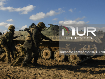 Servicemen of the First Presidential Brigade of the National Guard of Ukraine BUREVIY (Storm) practice evacuating a wounded soldier during a...