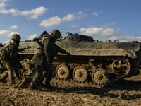 Servicemen of the First Presidential Brigade of the National Guard of Ukraine BUREVIY (Storm) practice evacuating a wounded soldier during a...