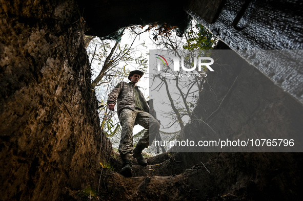 ZAPORIZHZHIA REGION, UKRAINE - NOVEMBER 03, 2023 - A serviceman of the Ukrainian anti-aircraft missile troops goes down to the dugout near R...